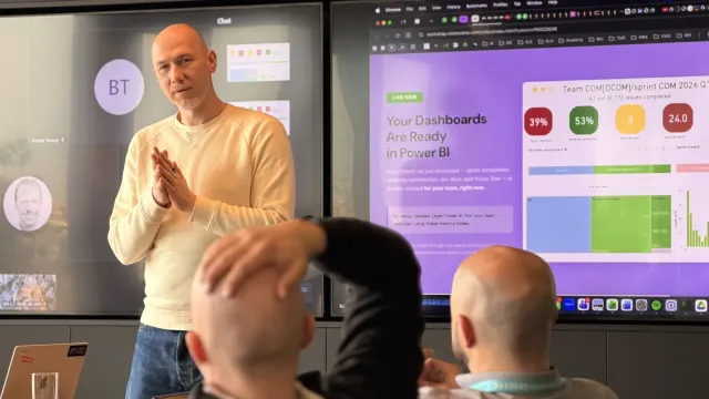 Marian Kamenistak leading a two-day engineering leadership workshop for a small group of managers, presenting at a screen.