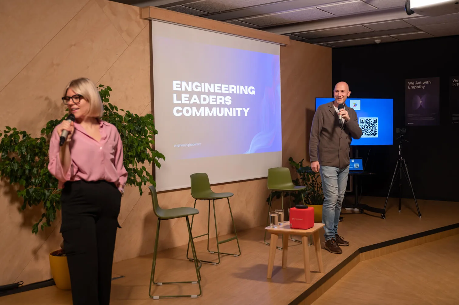 Marian Kamenistak and a co-host with microphones opening an Engineering Leaders Community meetup
