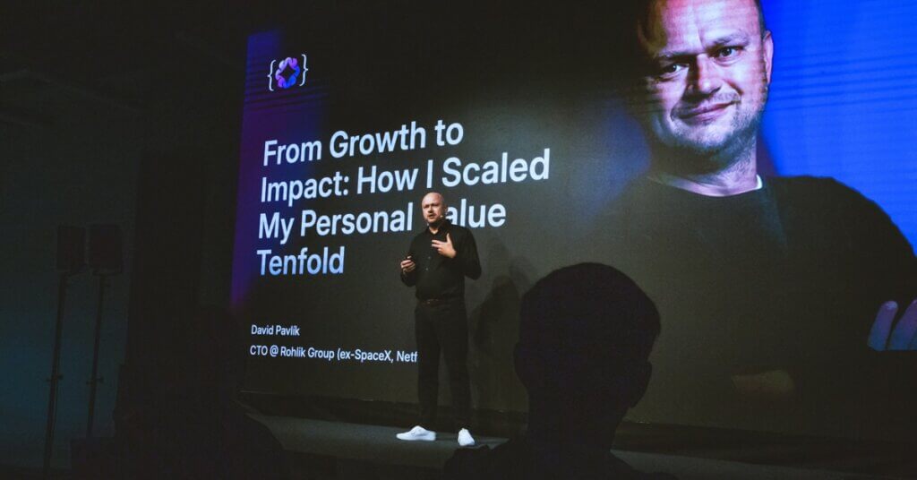 Photo of David Pavlík speaking on stage at ELC 2025, presenting his talk titled 'From Growth to Impact: How I Scaled My Personal Value 10x.
